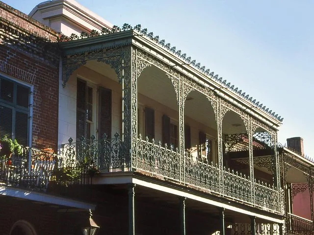A close-up view of the intricate cast-iron balcony on Gallier House.